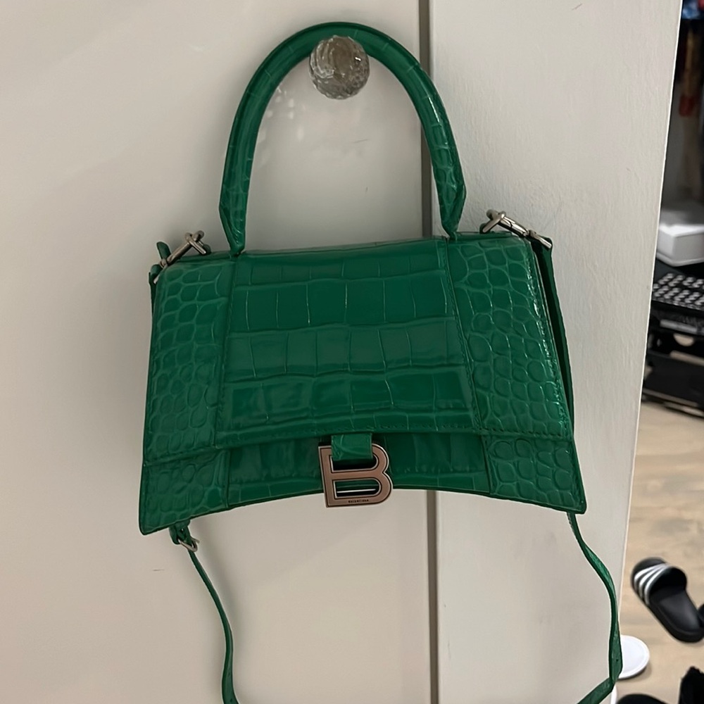 Worn only a few times. In excellent condition. Original box, tag and receipt.
